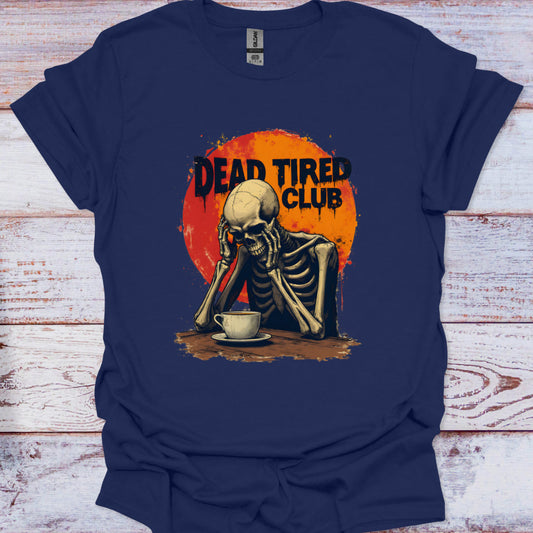Navy blue t-shirt with a skeleton and 'Dead Tired Club' graphic on a wooden surface