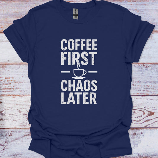 Navy blue t-shirt with 'Coffee First, Chaos Later' text on a wooden surface