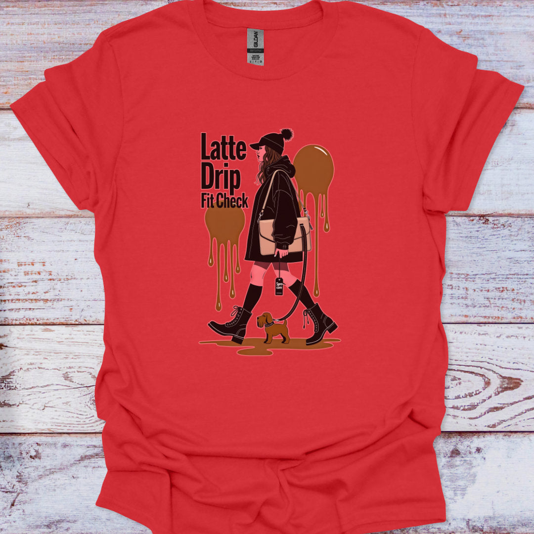 Red t-shirt with a graphic design of a woman walking a dog, labeled 'Latte Drip Fit Check', on a wooden surface.
