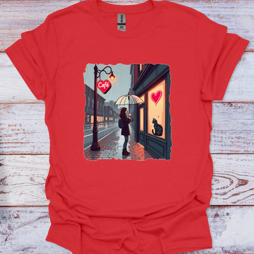 Red t-shirt with a graphic of a person at a cafe window with a heart and a cat.