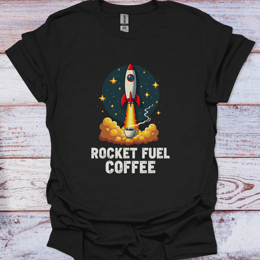 Black t-shirt with a graphic of a rocket and coffee cup labeled 'Rocket Fuel Coffee' on a wooden surface.