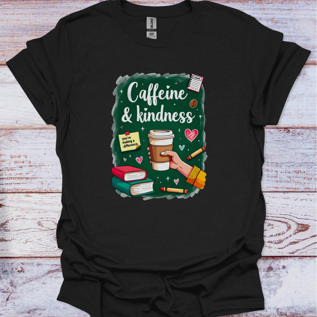 Black t-shirt with 'Caffeine & Kindness' graphic design on a wooden surface