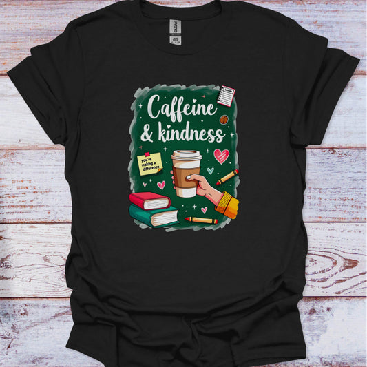 Black t-shirt with 'Caffeine & Kindness' graphic design on a wooden surface