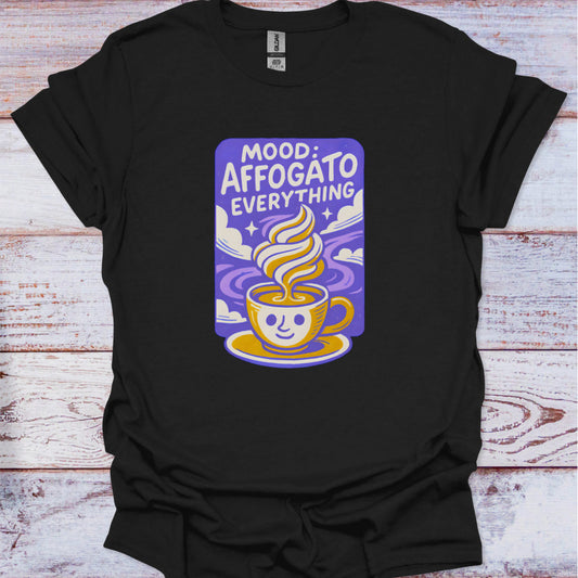 Black t-shirt with a colorful graphic and text on a wooden surface