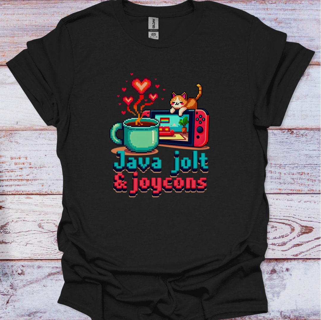 Black t-shirt with a graphic design of a coffee cup, gaming console, and cat, with text 'Java jolt & joycons' on a wooden surface.