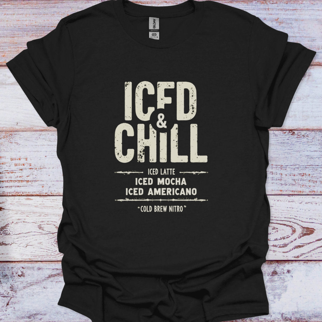 Black t-shirt with 'ICED & CHILL' text on a wooden surface