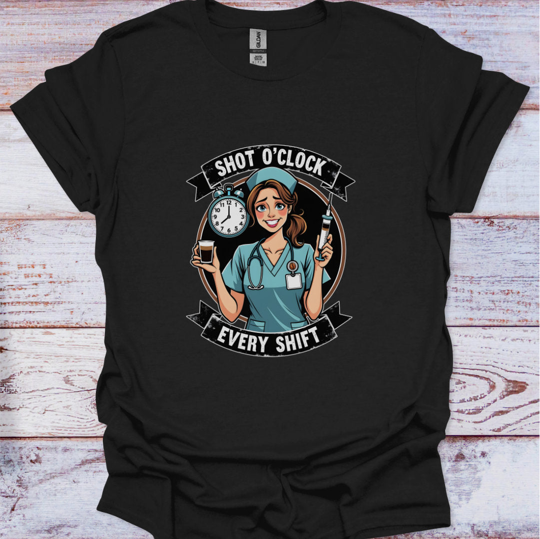 Black t-shirt with a graphic of a nurse holding a clock and a bottle, text 'Shot O'Clock Every Shift', on a wooden surface.