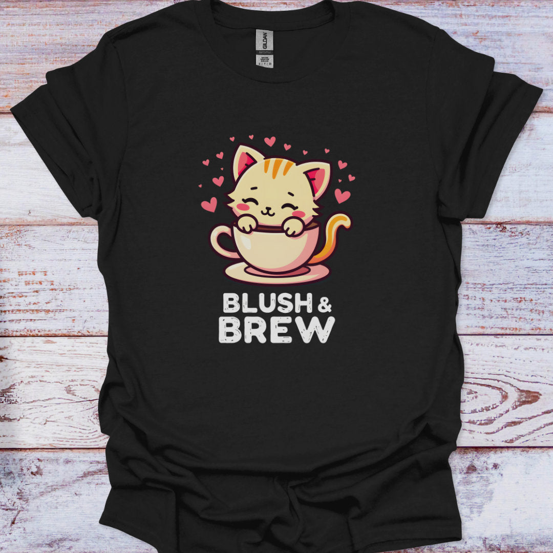 Black t-shirt with a cat holding a coffee cup design and 'Blush & Brew' text on a wooden surface.