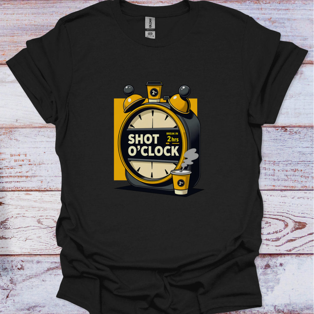 Black t-shirt with a graphic design of an alarm clock and shot glass on a wooden surface