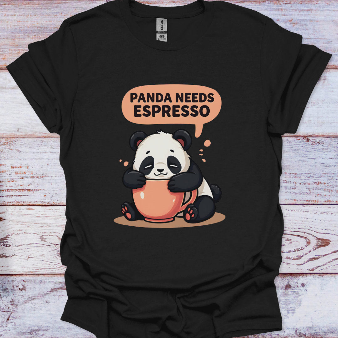 Black t-shirt with a panda holding an espresso cup and speech bubble saying 'Panda Needs Espresso' on a wooden surface.