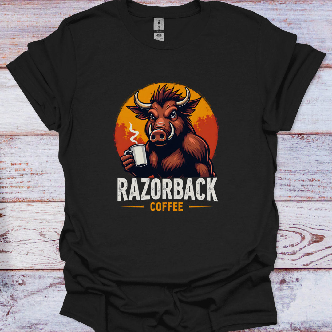 Black t-shirt with a Razorback coffee graphic on a wooden surface