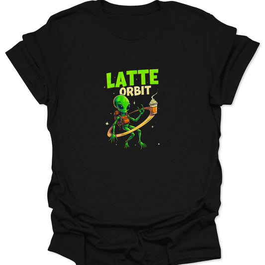 Graphic tee with a green alien, wearing a backpack, orbiting a foamy latte cup against a black background. Text reads LATTE ORBIT.