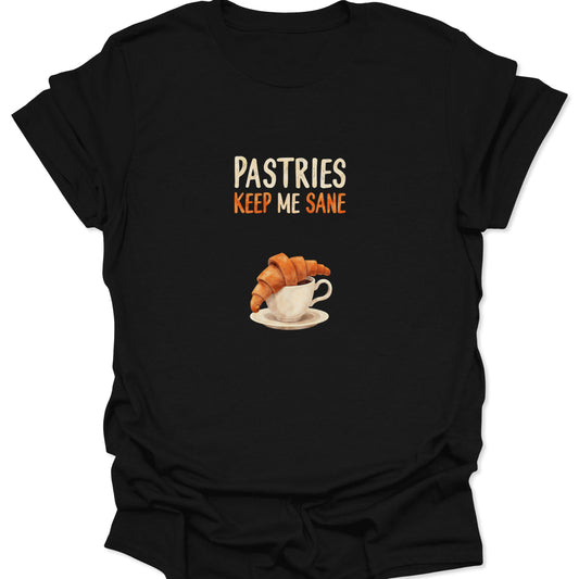 Realistic croissant inside a teacup illustration with text Pastries Keep Me Sane on a black t-shirt.