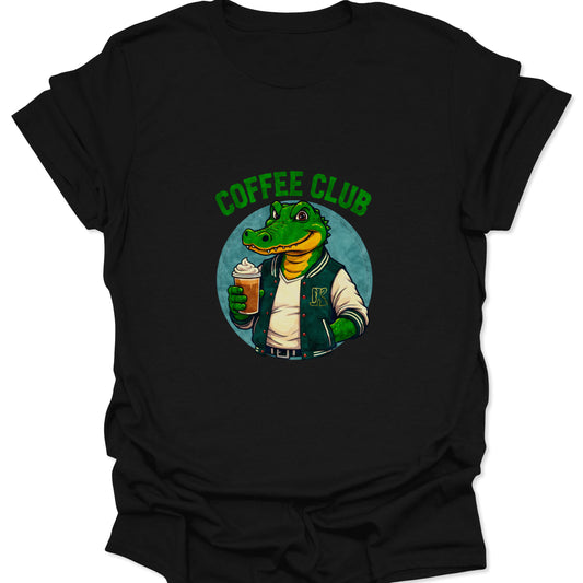 Dark black t-shirt with a centered, high-saturation graphic of a green alligator in a varsity jacket holding an iced coffee drink.
