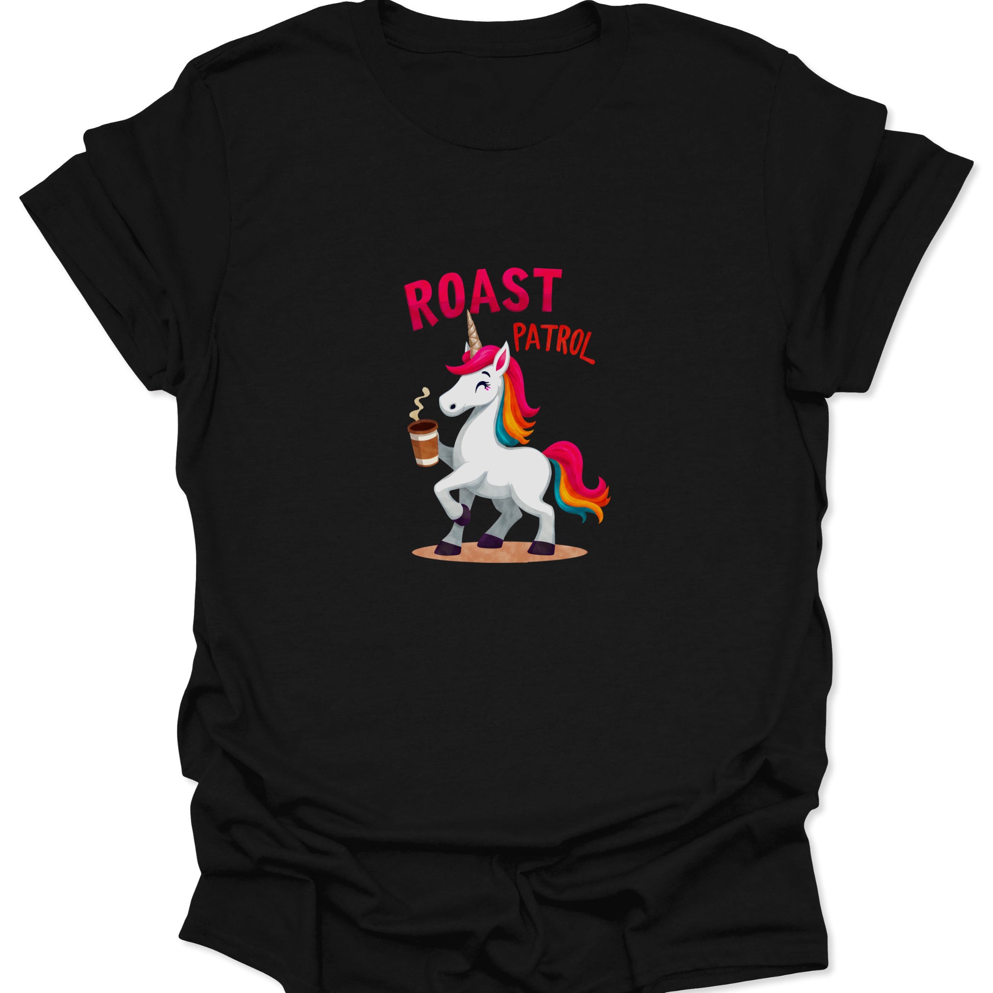 Close-up of Roast Patrol unicorn t-shirt on a dark background. Black garment features a colorful graphic of a unicorn holding a steaming coffee cup.