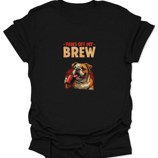 Black t-shirt featuring a highly detailed, aggressively possessive bulldog guarding a red coffee mug with the text "PAWS OFF MY BREW." Graphic uses red, orange, white, and brown on a black ground.