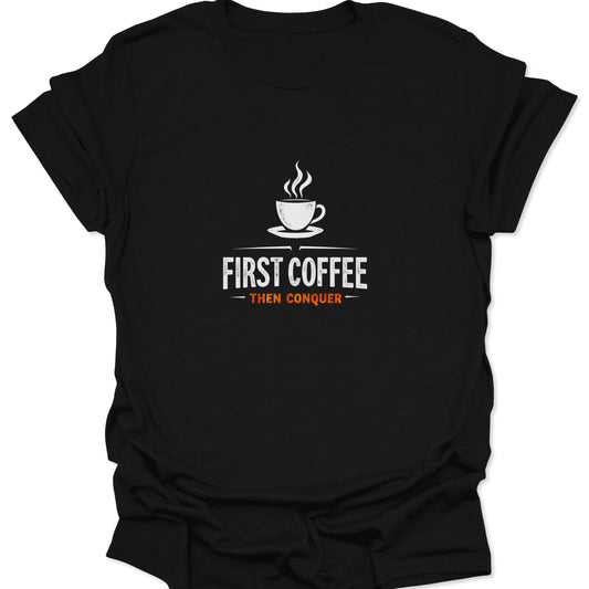 High-contrast white and orange graphic tee featuring a coffee cup and the motivational phrase "First Coffee Then Conquer" on a solid black fabric.