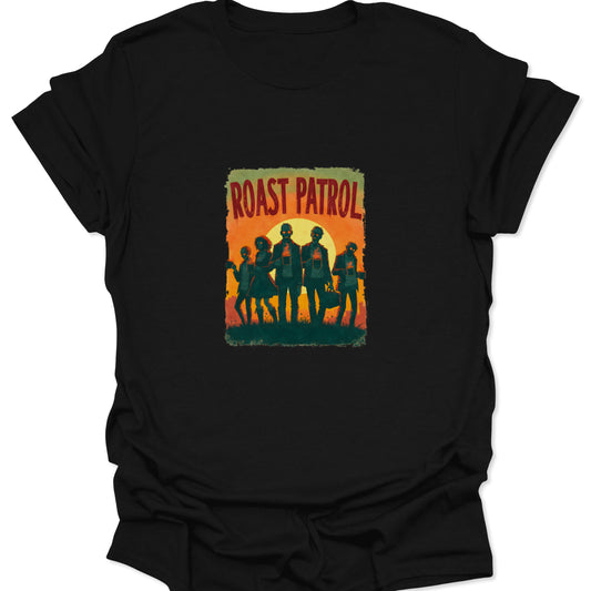 Close-up of black t-shirt featuring a distressed, retro-style graphic titled "ROAST PATROL" with silhouetted figures against a vintage orange and yellow sunset.