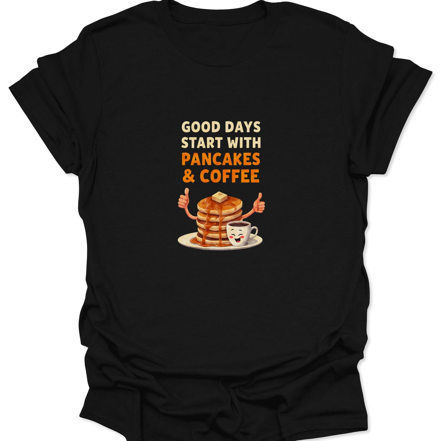 Close-up of black graphic t-shirt featuring a cartoon pancake stack and coffee mug with bold orange and white text.