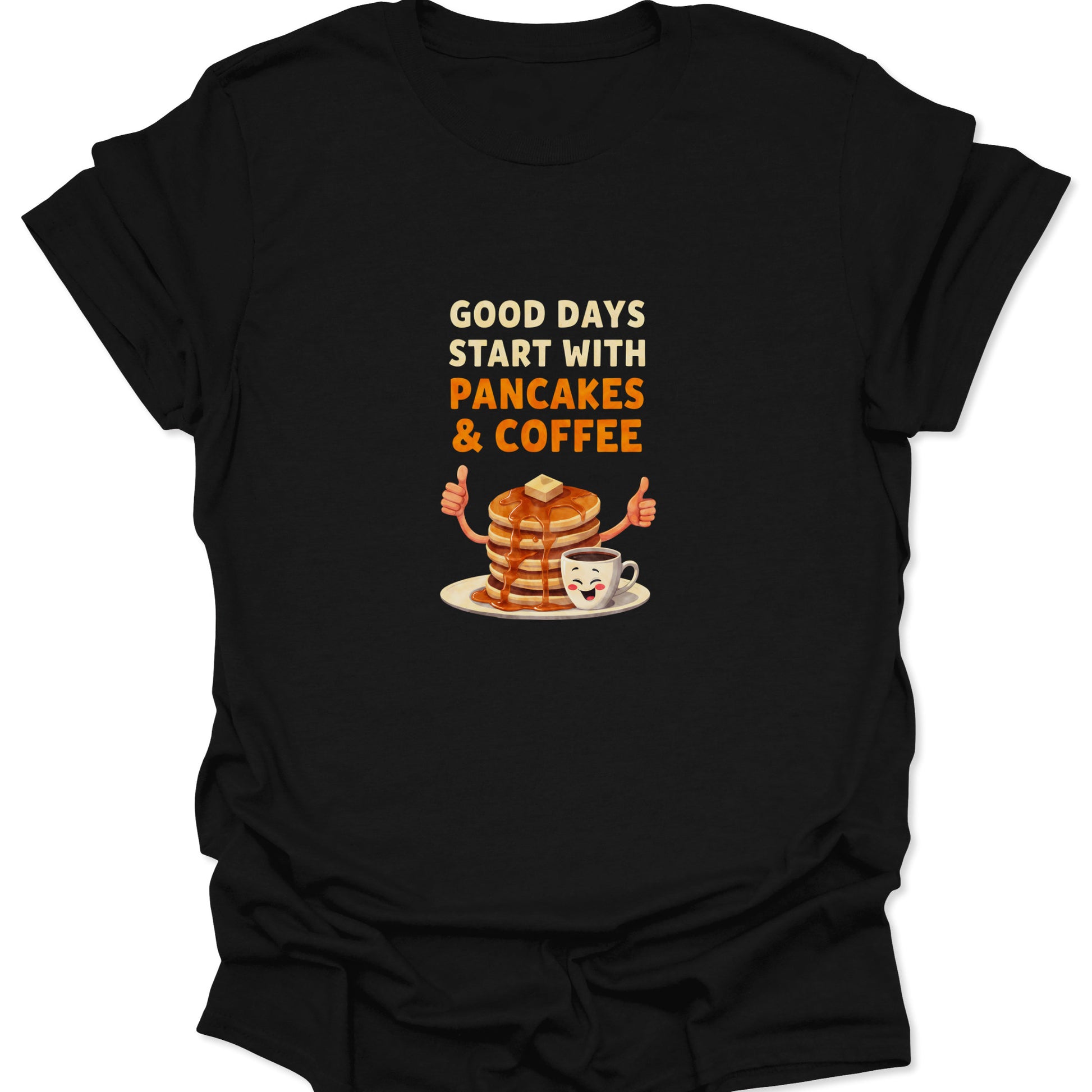 Close-up of black graphic t-shirt featuring a cartoon pancake stack and coffee mug with bold orange and white text.
