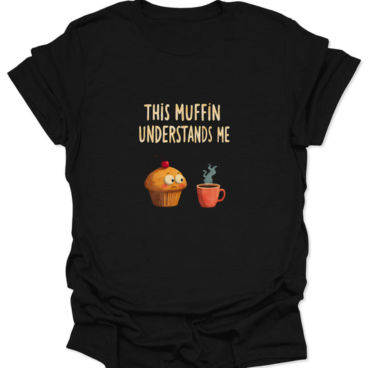 Black t-shirt featuring a sad cartoon muffin with a cherry looking at a red coffee mug.