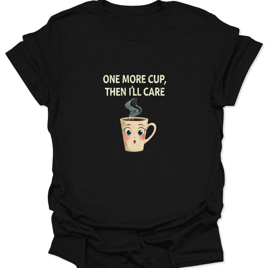 Black t-shirt with "ONE MORE CUP, THEN I'LL CARE" text and expressive cartoon coffee mug graphic.