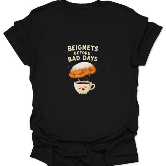 Black t-shirt featuring a cute beignet dusting sugar into a happy coffee cup with text Beignets Before Bad Days.