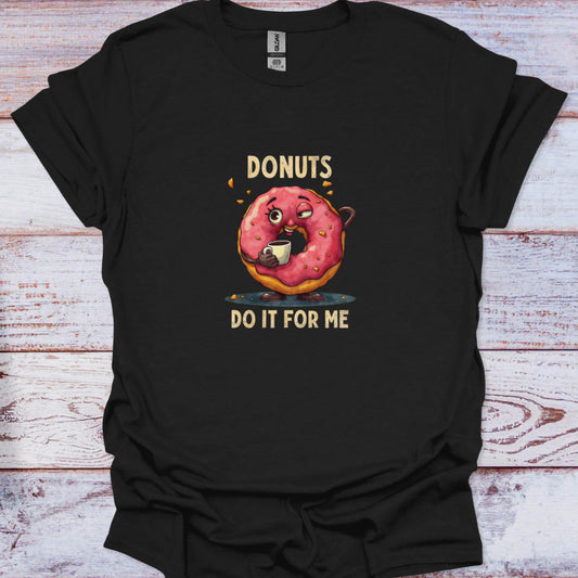 Close-up of black t-shirt featuring a funny, tired-looking pink-glazed donut character drinking coffee with the text 'DONUTS DO IT FOR ME'.