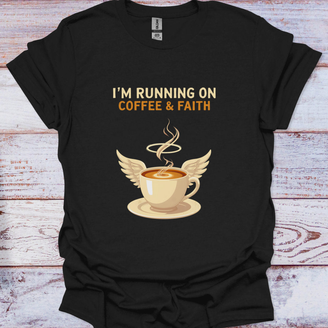 Black t-shirt with a coffee cup graphic and text 'I'm running on coffee & faith' on a wooden surface.