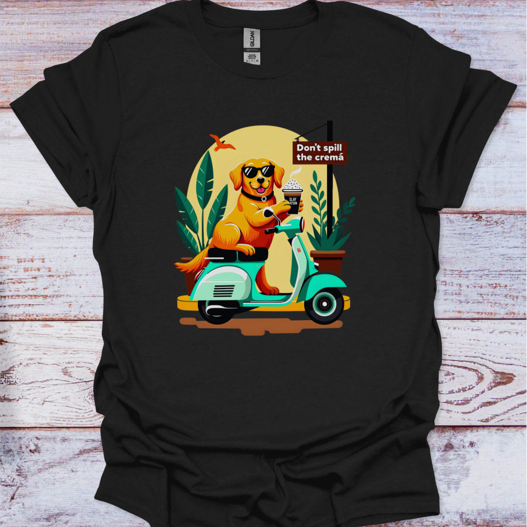 Black t-shirt with a graphic of a dog on a scooter and text 'Don't spill the crema' on a wooden surface.