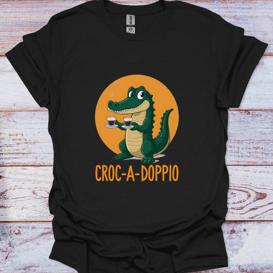 Black t-shirt with a cartoon crocodile holding two coffee cups and 'Croc-A-Doppio' text on an orange circle background.