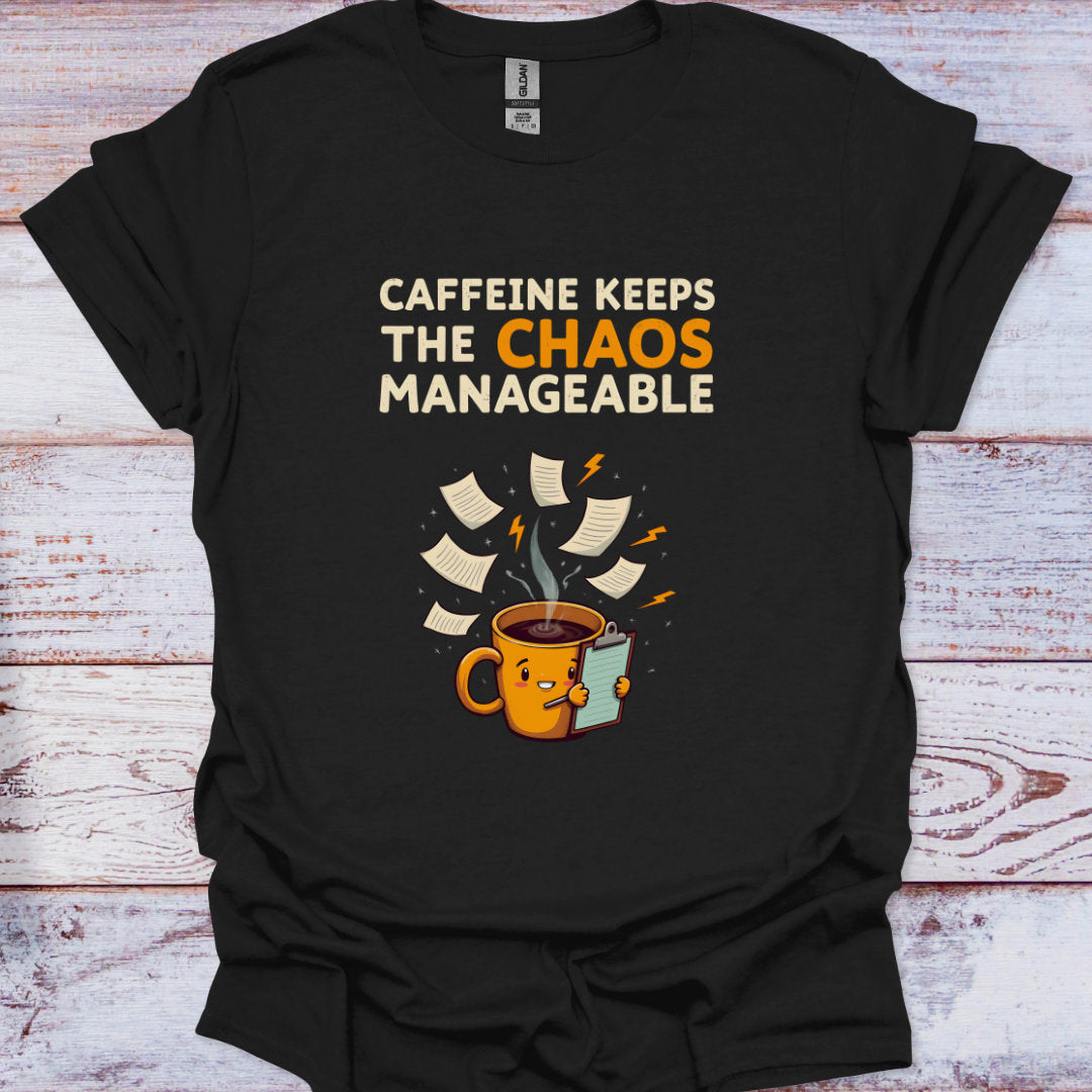 Black t-shirt with a coffee cup graphic and text on a wooden surface