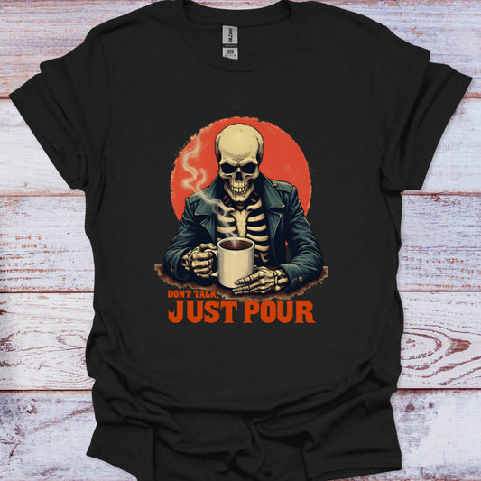 Black t-shirt with a skeleton holding a cup and 'Don't Talk Just Pour' text on a wooden surface