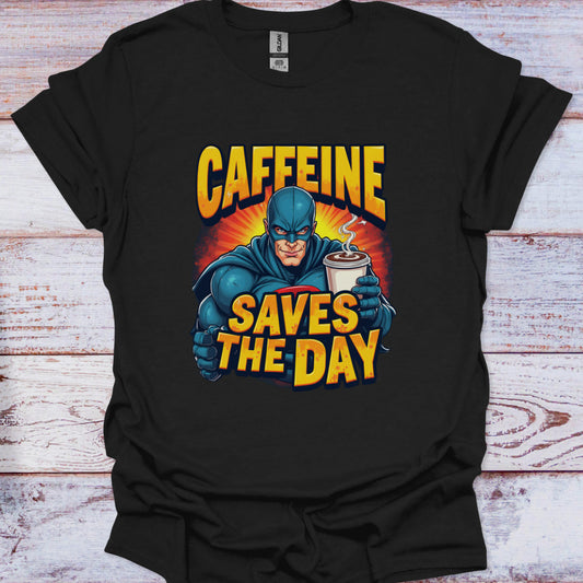 Black t-shirt with superhero graphic and 'Caffeine Saves the Day' text on a wooden surface