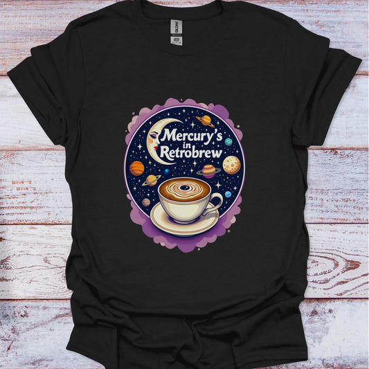 Black t-shirt with a coffee-themed graphic design on a wooden surface