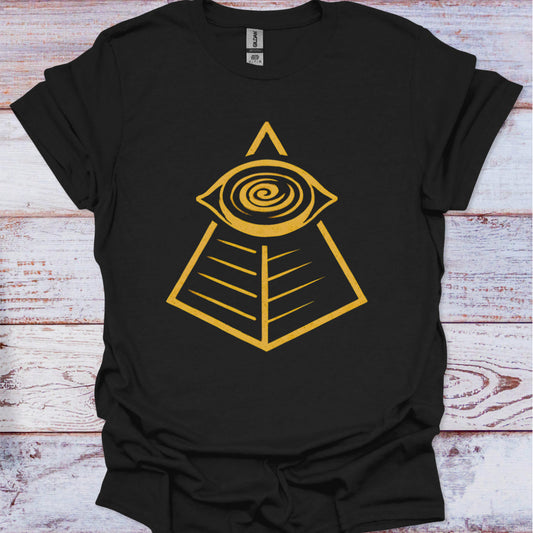 Black t-shirt with a yellow pyramid and eye design on a wooden surface