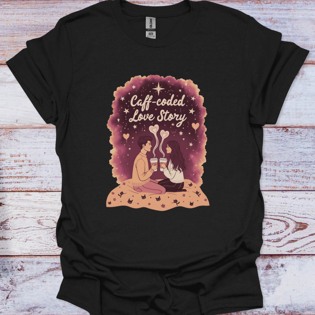 Black t-shirt with 'Caff-coded Love Story' graphic design on a wooden surface