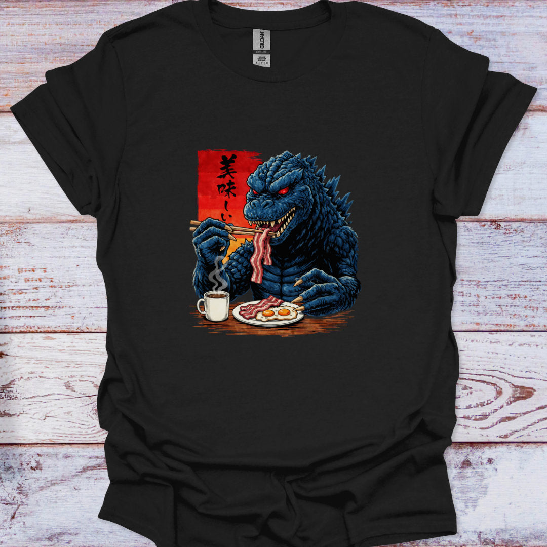 Black t-shirt with a graphic of kaiju having breakfast on a wooden surface