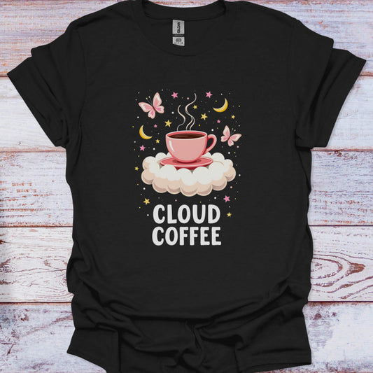 Black t-shirt with 'Cloud Coffee' design featuring a pink cup on a cloud, butterflies, and stars on a wooden surface.
