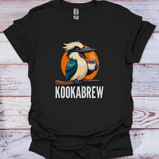 Black t-shirt with a kookaburra holding a coffee cup and 'KOOKABREW' text on a wooden surface