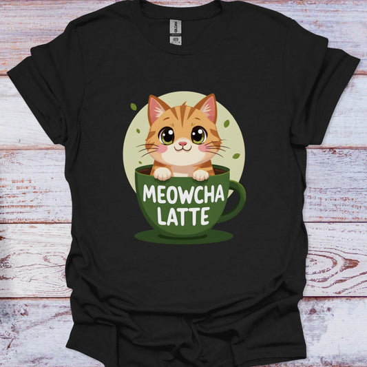 Black t-shirt with a cat in a coffee cup graphic and 'MEOWCHA LATTE' text on a wooden surface.
