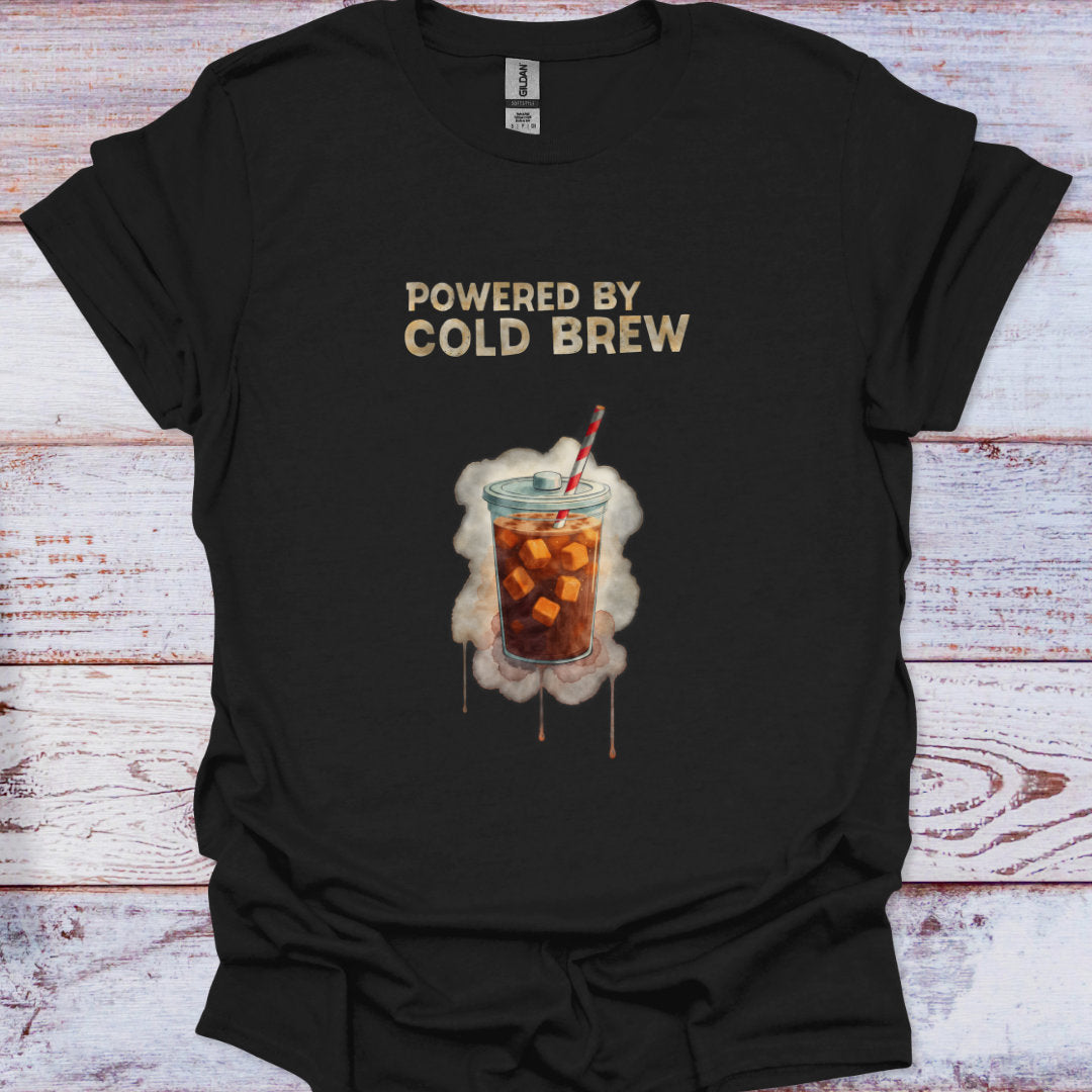 Black t-shirt with a graphic of iced coffee and 'Powered by Cold Brew' text on a wooden surface.