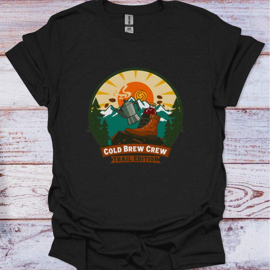 Black t-shirt with 'Cold Brew Crew Trail Edition' graphic on a wooden surface