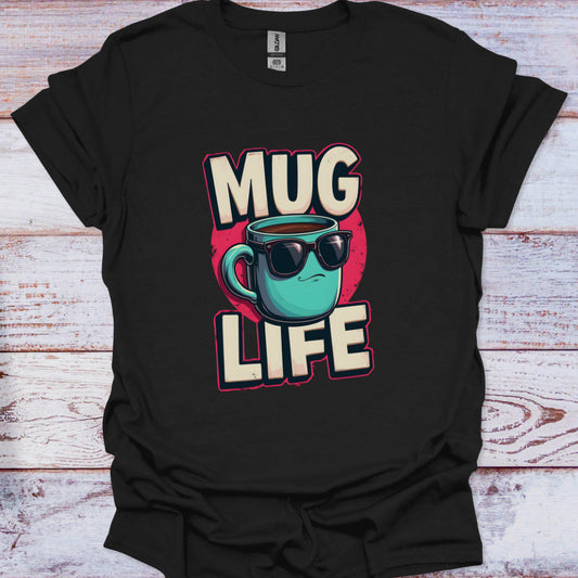 Black t-shirt with 'Mug Life' graphic design featuring a mug wearing sunglasses on a wooden surface.