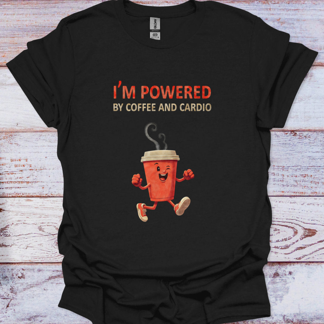 Black t-shirt with a cartoon coffee cup and text 'I'm powered by coffee and cardio' on a wooden surface.