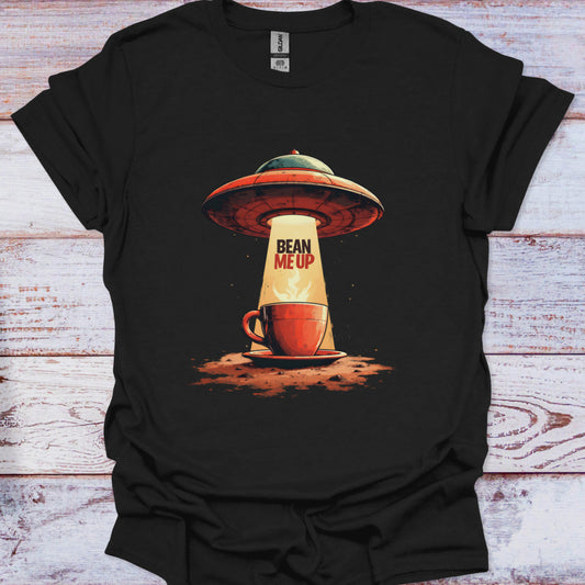 Black t-shirt with a UFO and coffee cup design on a wooden surface