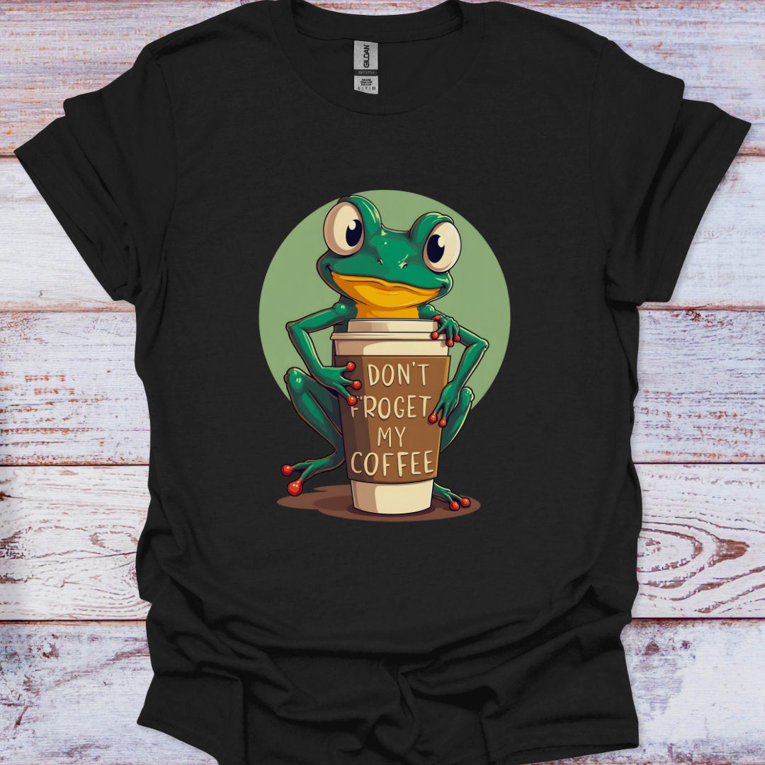 Black t-shirt with a frog holding a coffee cup graphic on a wooden surface