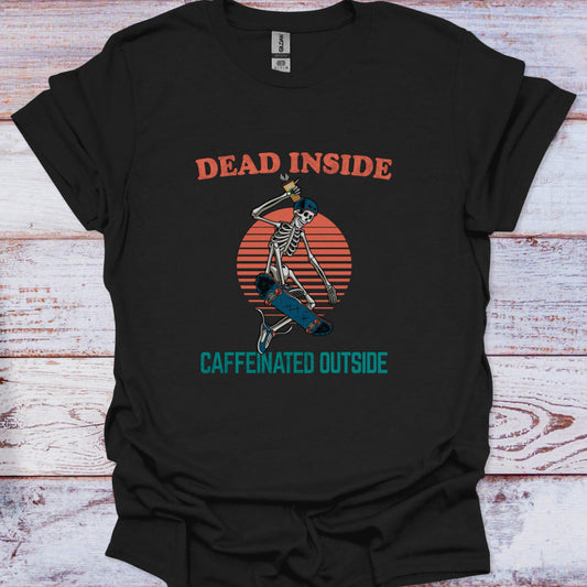 Black t-shirt with skeleton design and text 'Dead Inside, Caffeinated Outside' on a wooden surface