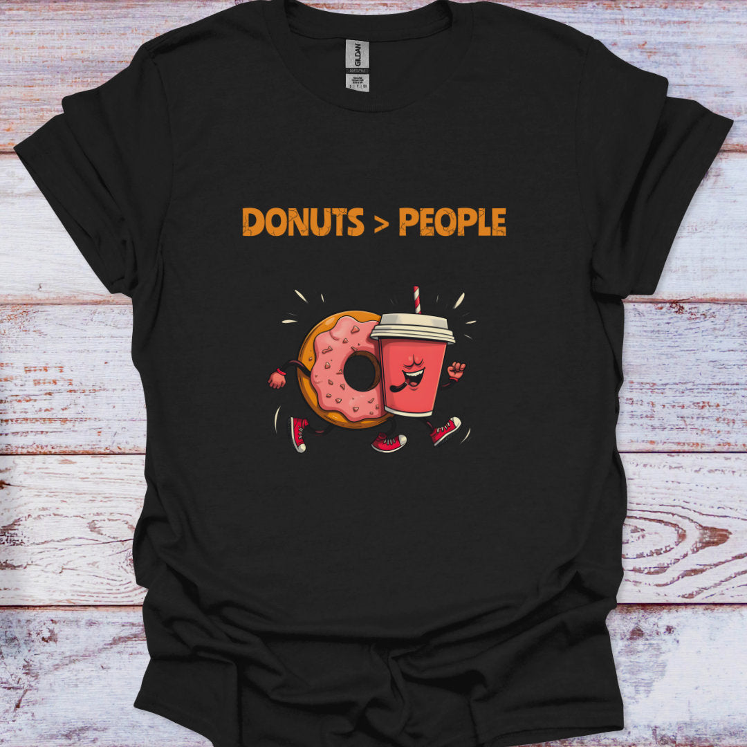 Black t-shirt with 'Donuts > People' graphic design on a wooden surface