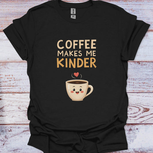 Black t-shirt with a coffee cup graphic and text 'Coffee Makes Me Kinder' on a wooden surface.